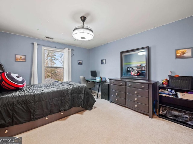 bedroom featuring light colored carpet