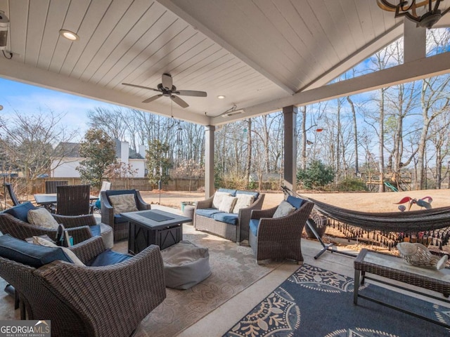 view of patio featuring ceiling fan and an outdoor living space