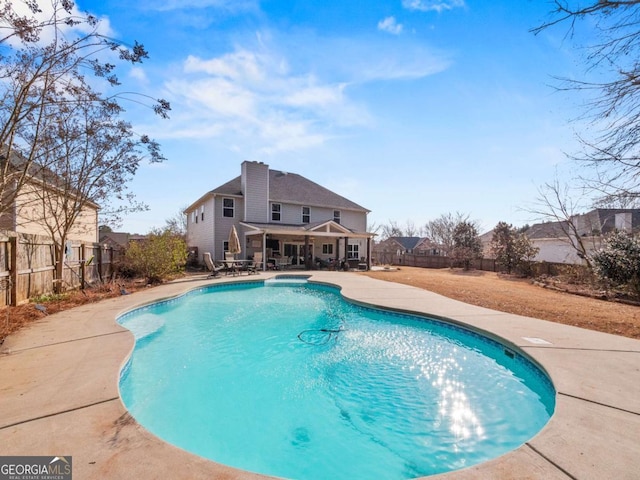 view of swimming pool featuring a patio