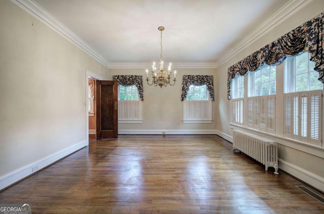 unfurnished dining area with ornamental molding, dark hardwood / wood-style floors, and radiator