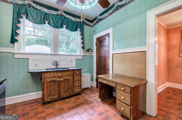 office space with sink, radiator heating unit, ornamental molding, and ceiling fan