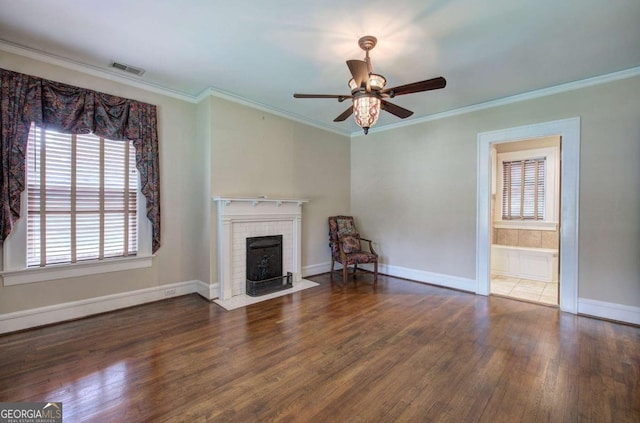 unfurnished living room featuring crown molding, ceiling fan, and dark wood-type flooring