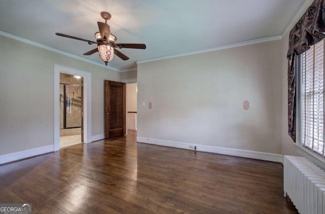 unfurnished room featuring dark hardwood / wood-style flooring, radiator, crown molding, and ceiling fan