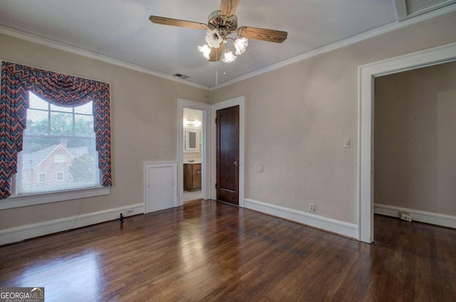 interior space featuring crown molding, ensuite bathroom, ceiling fan, and dark hardwood / wood-style flooring