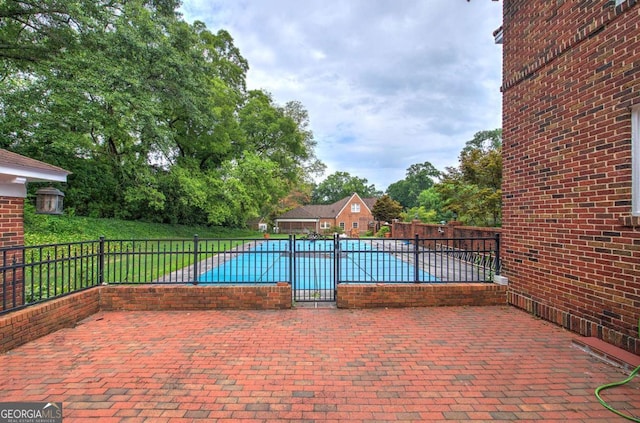 exterior space with a covered pool