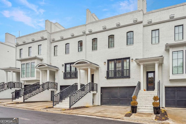 townhome / multi-family property featuring a garage