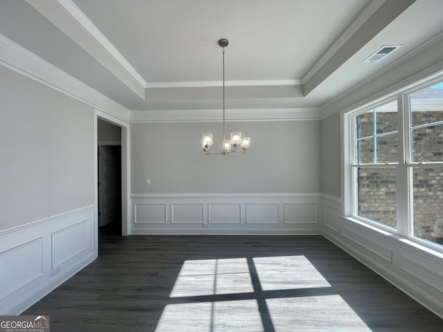 unfurnished dining area with a tray ceiling, dark wood-style flooring, visible vents, and a notable chandelier