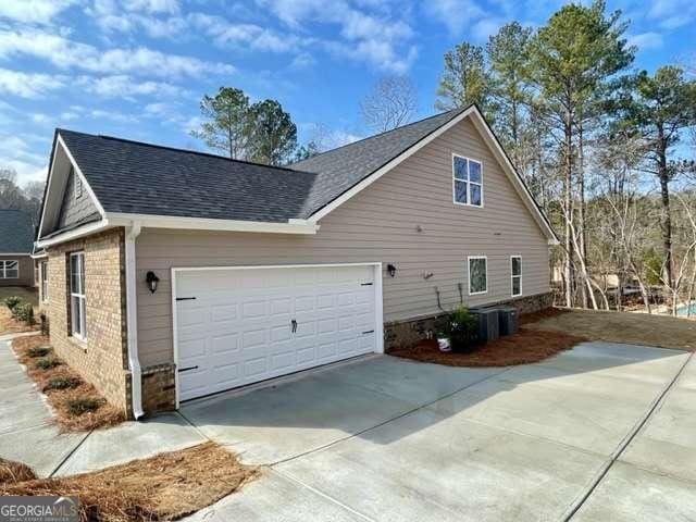 view of side of property featuring a garage