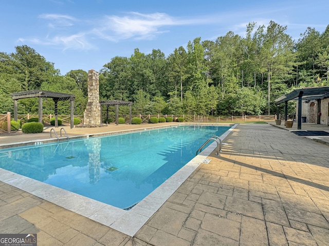 community pool featuring a patio area and a pergola