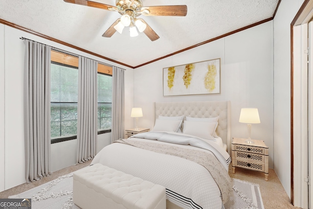 carpeted bedroom with ornamental molding, vaulted ceiling, ceiling fan, and a textured ceiling