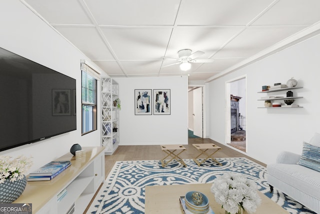 living room with ceiling fan and light hardwood / wood-style floors