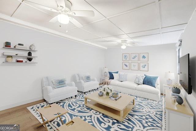 living room with light hardwood / wood-style floors and ceiling fan