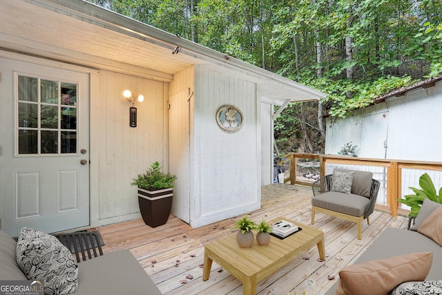 wooden deck featuring outdoor lounge area