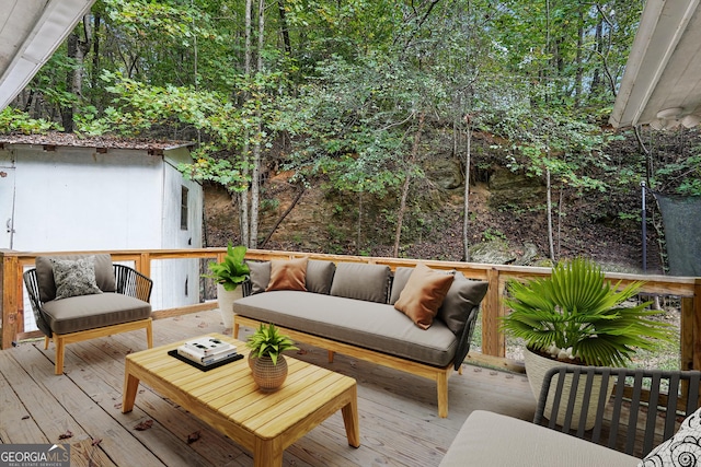 wooden terrace featuring an outdoor living space