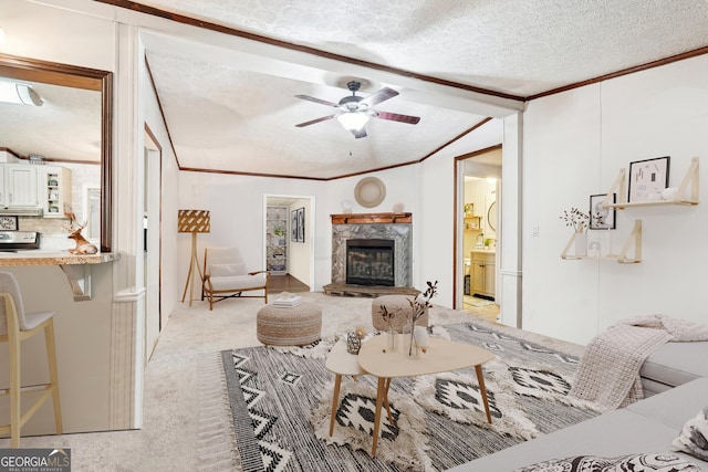 living room featuring crown molding, light carpet, ceiling fan, and a textured ceiling