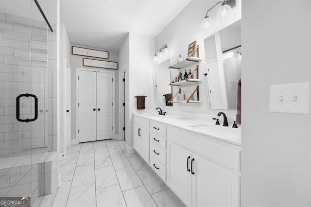 bathroom with vanity and a shower with door