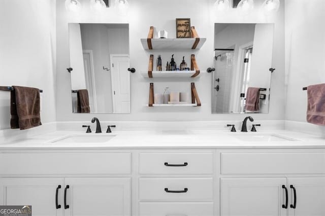 bathroom with vanity and a shower