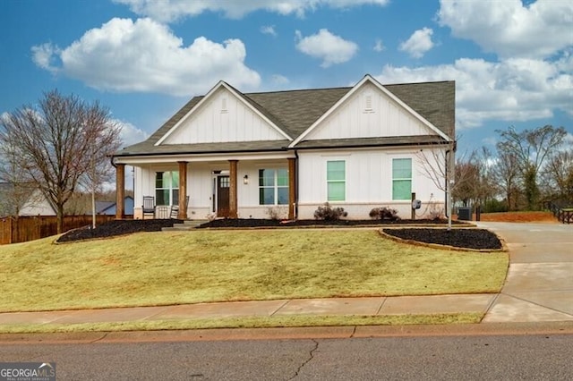 view of front of property with a porch and a front yard