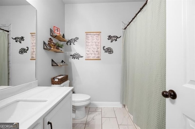 bathroom featuring vanity and toilet