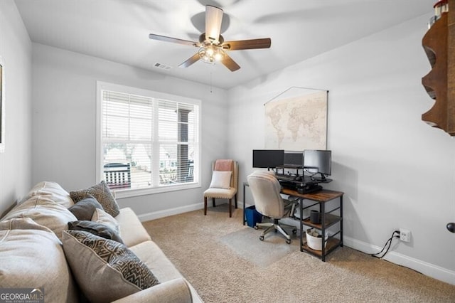 office area featuring light colored carpet and ceiling fan