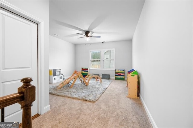 game room featuring ceiling fan and carpet