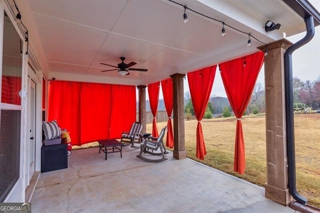 view of patio featuring ceiling fan