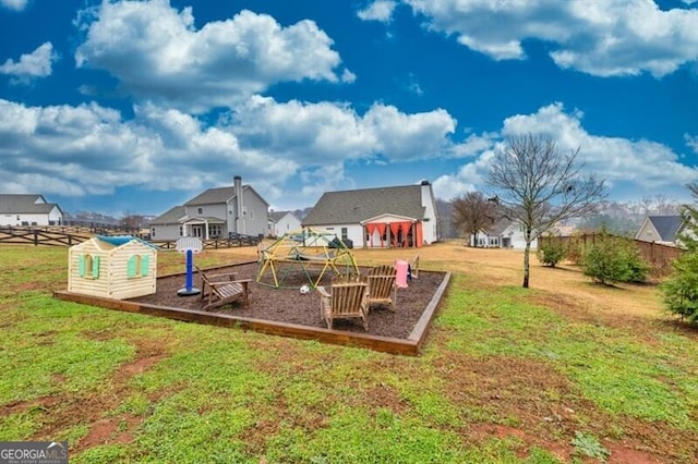 view of playground with a yard