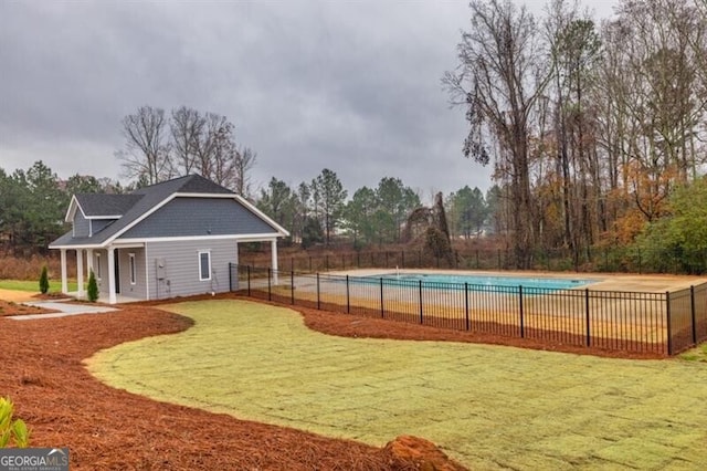 exterior space with a pool and a yard