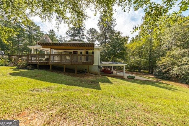 rear view of house featuring a wooden deck and a lawn