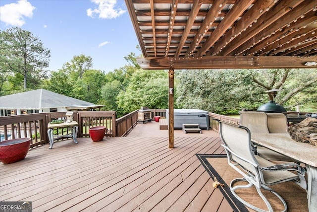 wooden deck with a hot tub