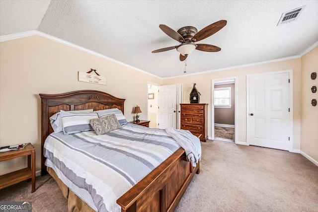 carpeted bedroom with ceiling fan, lofted ceiling, ornamental molding, and a textured ceiling