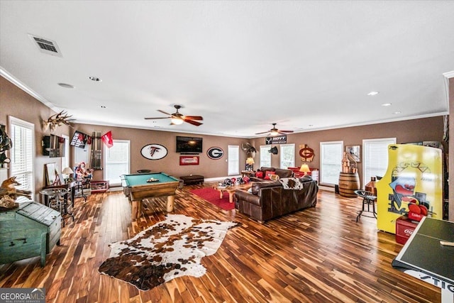 game room featuring billiards, ornamental molding, dark hardwood / wood-style flooring, and a wealth of natural light