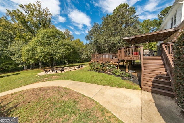 view of yard featuring a fire pit and a deck