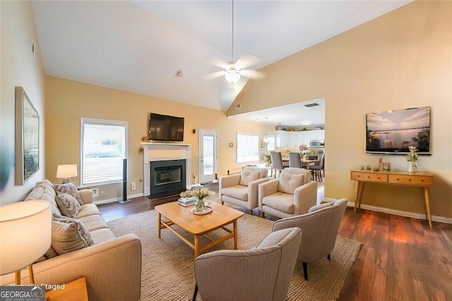 living room with high vaulted ceiling, dark hardwood / wood-style floors, and ceiling fan