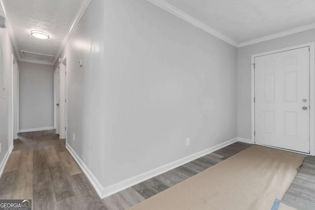 entryway with ornamental molding, dark hardwood / wood-style floors, and a textured ceiling