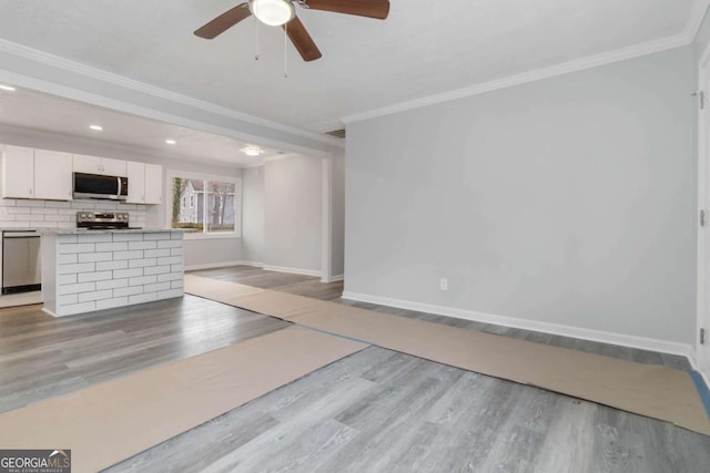 unfurnished living room with crown molding, ceiling fan, and light wood-type flooring