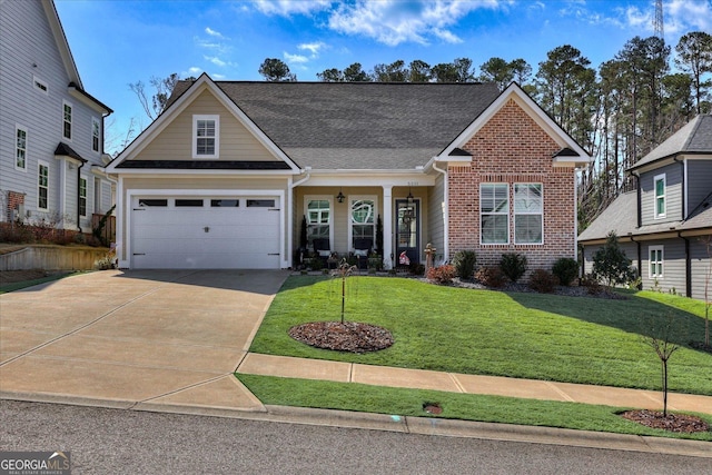 traditional-style home featuring an attached garage, brick siding, concrete driveway, roof with shingles, and a front lawn