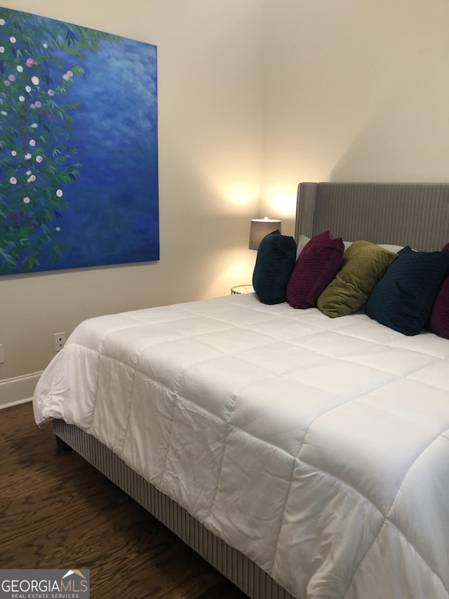 bedroom featuring hardwood / wood-style flooring