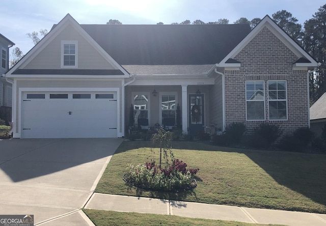 view of front of house featuring a garage and a front yard