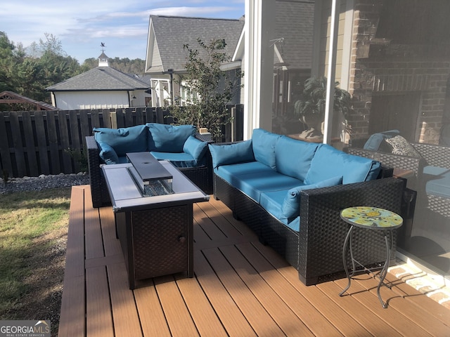 wooden terrace featuring an outdoor hangout area