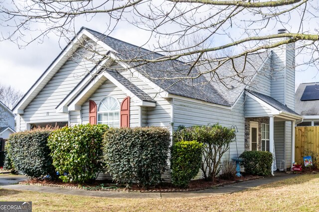 view of side of home featuring a yard