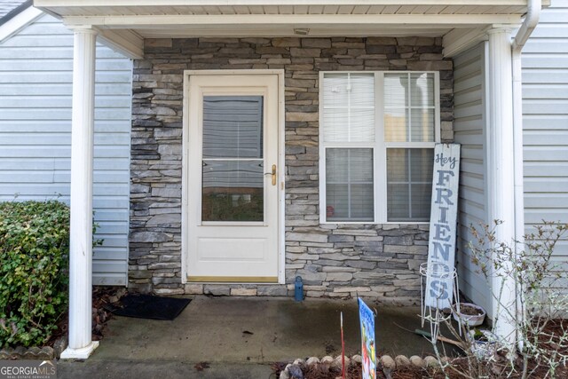 view of front of home featuring a garage and a front yard