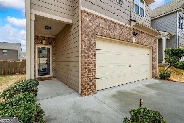 exterior space featuring fence and driveway