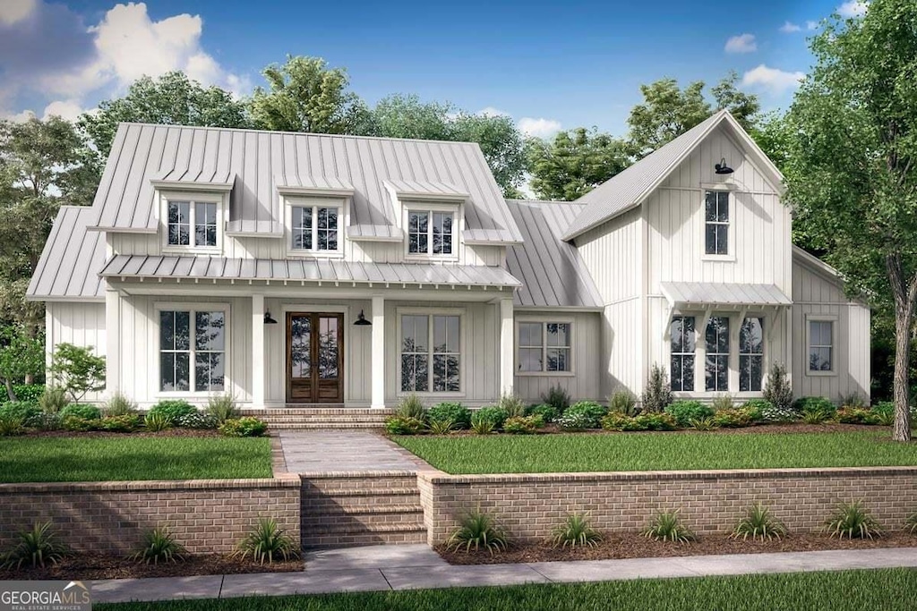 modern farmhouse with french doors and a front yard