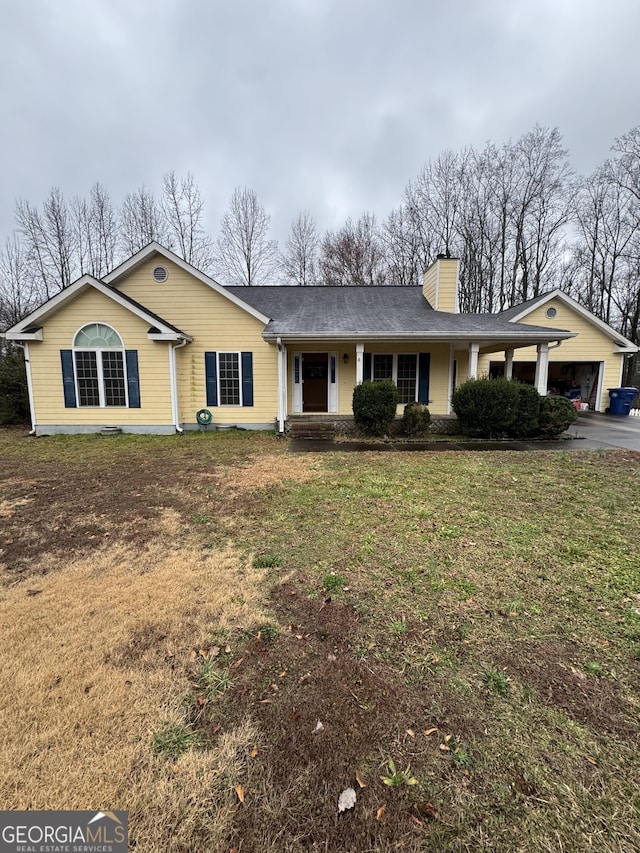 ranch-style home with a front lawn