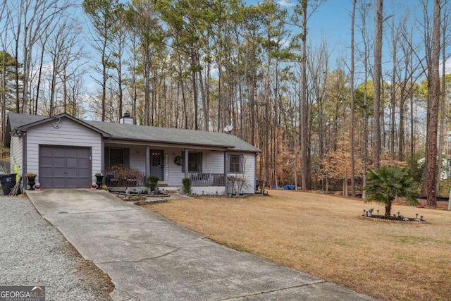 view of front of property with a porch, a garage, and a front lawn