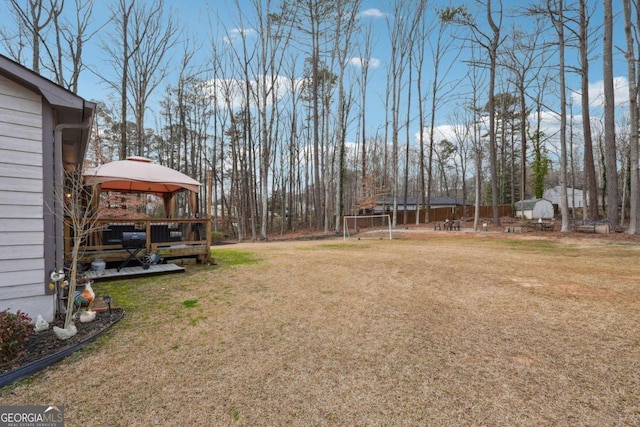 view of yard with a gazebo and a trampoline