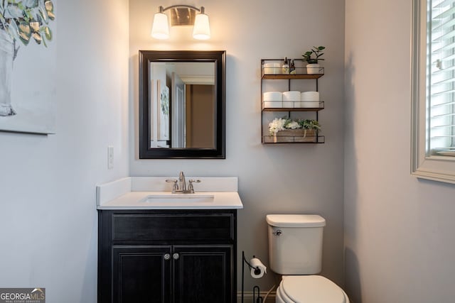 bathroom with vanity and toilet