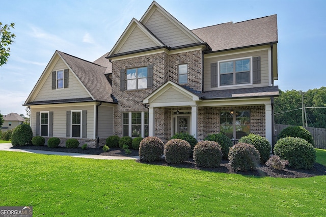 craftsman inspired home featuring a front yard