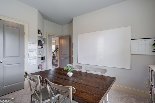 view of carpeted dining area